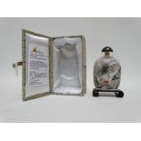 Chinese glass snuff bottle and stopper - reverse painted with a river scene, with stand, height 9cm,