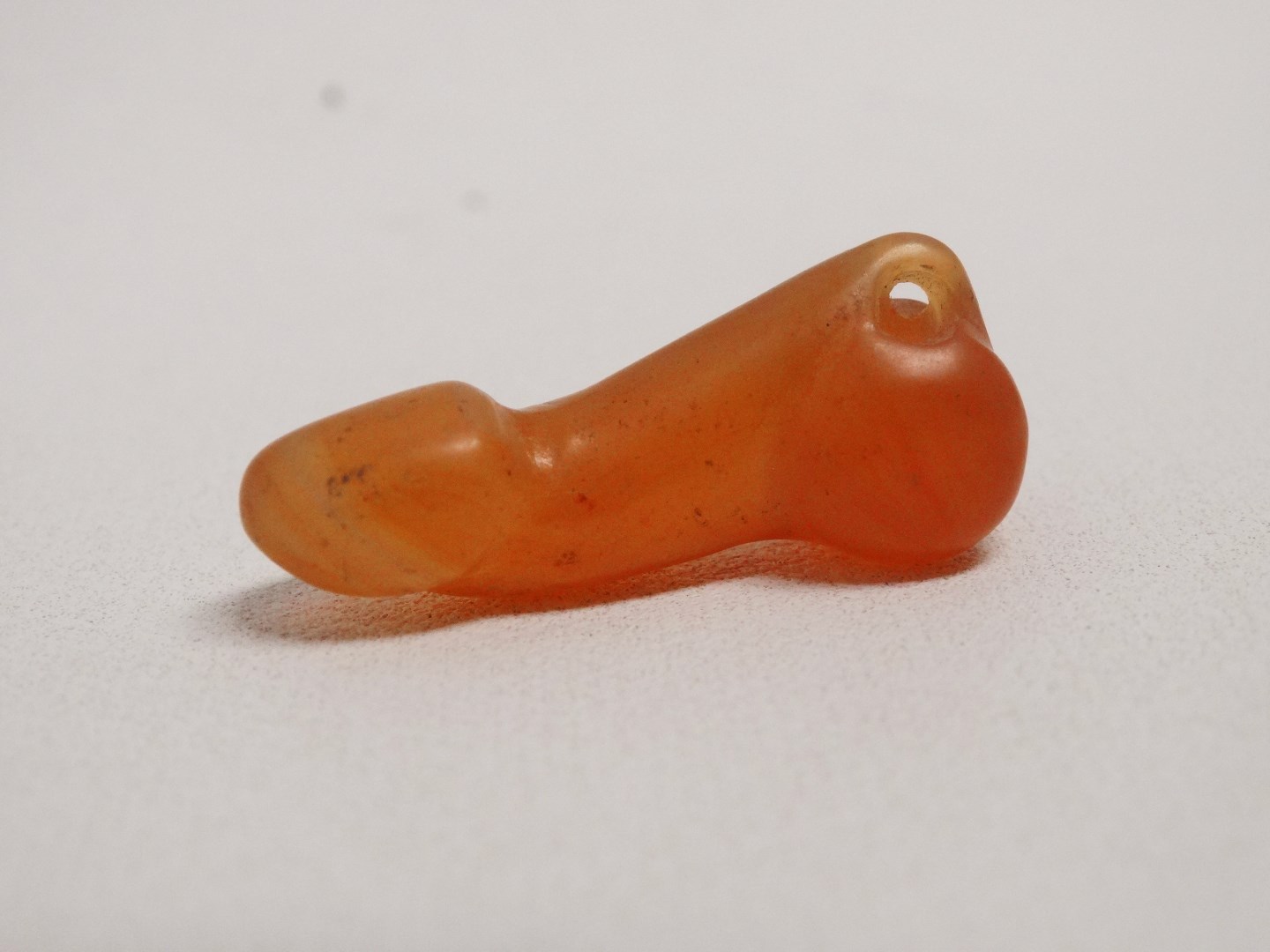 A 19th century hardstone phallus - length 4cm, together with another similar smaller one. - Image 5 of 5