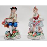 A pair of early 20th century German figures - gallant with flower basket and a similar maid,