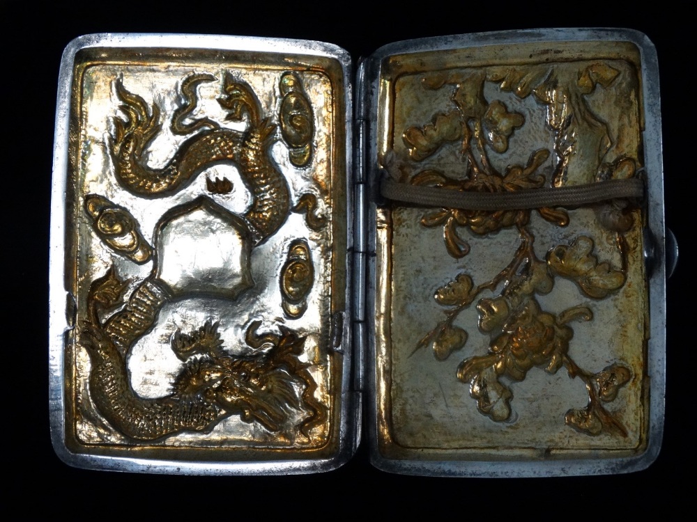 An early 20th century Chinese white metal cigarette case - decorated with a dragon amongst clouds, - Image 2 of 5