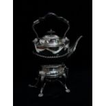 A 20th century silver plated kettle and stand - Oval stop fluted, the stand with shaped reed legs