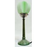An Art Deco style green marbled Lucite table lamp - of faceted tapering form on a circular base,