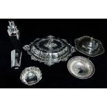 An impressive silver plated entree dish - Of shaped oval form with scrolls, foliage and vacant