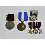 Medals - a small collection of medals, to include a bar of three miniature WWI medals, a UN Peace