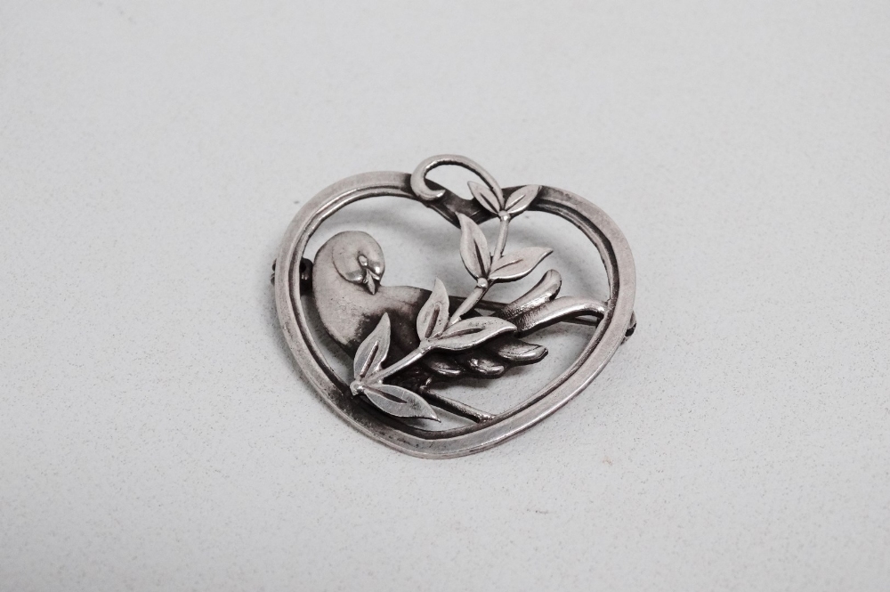 A Scandinavian 20th century silver brooch - modelled as a dove with foliage within a heart, weight