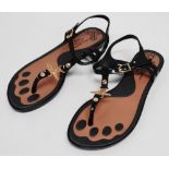 A pair of Vivienne Westwood sandals - black PVC upper and sole with gilt fittings, together with