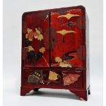 A late 19th century Japanese table cabinet - cinnamon lacquer, with double doors enclosing drawers