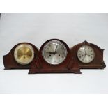 A mid 20th century oak mantel clock - the silvered and brass dial set out in Roman numerals fitted
