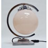 An Art Deco chrome desk lamp - the blush pink globe shade within a C-shaped support and square
