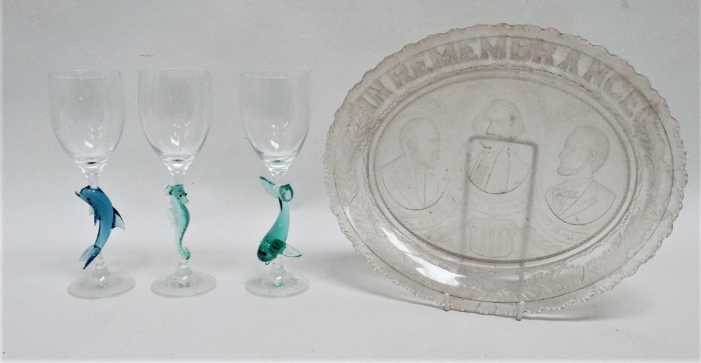 An oval clear pressed glass bread plate - possibly American, width 32cm, together with three wine