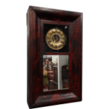 A late 19th century American mahogany cased wall clock - the brassed dial set out in Roman