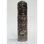 An Indian silver cylindrical box - Repousse decorated with elephants, tigers and stag in a palm