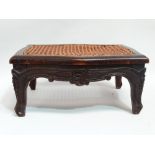 A Louise XVI style walnut low foot stool - rectangular serpentine form with a cane seat, 37cm (