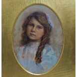 Early 20th Century British School Portrait Of A Young Girl Oil on canvas Framed as oval Framed and