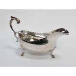 A silver sauce boat - Dublin 1969, Royal Irish Silver Ltd, with scalloped rim, C-scroll handles