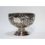 A silver repousse bowl - Chester 1904, with extensive foliate decoration incorporating three