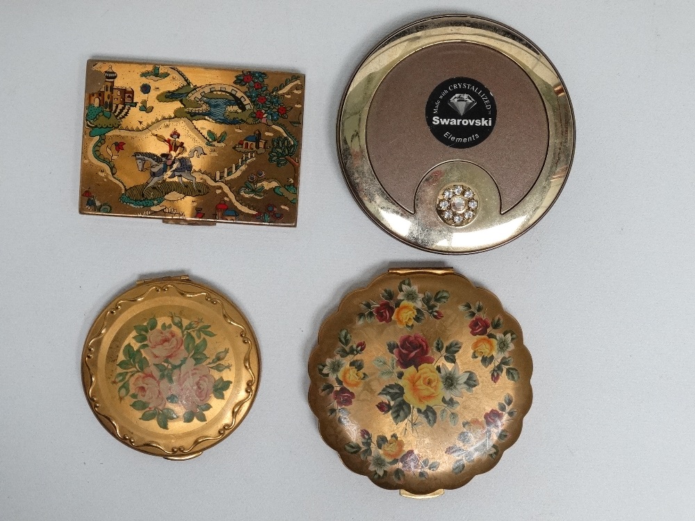 A Swarovski crystal compact - together with three further mid 20th century compacts (4)