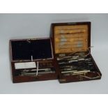 A late 19th century mahogany box of drawing instruments - with a tray of nickel plated equipment