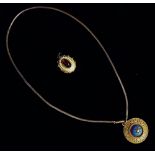 A Victorian gilt pendant - Etruscan style set with a pearl on light blue enamel button within a