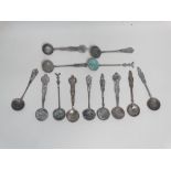 Coin and medallion spoons - fourteen continental coin and medallion style spoons, bearing Russian