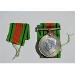 Medals - a WWII Defence medal, together with it's box of issue to W.J. Dutton, Birmingham.