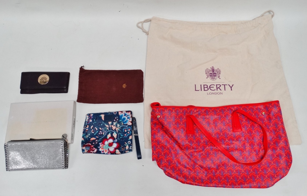 A Liberty Iphis pattern tote bag - red leather binding and handles, with wardrobe bag, together with