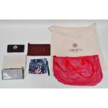 A Liberty Iphis pattern tote bag - red leather binding and handles, with wardrobe bag, together with