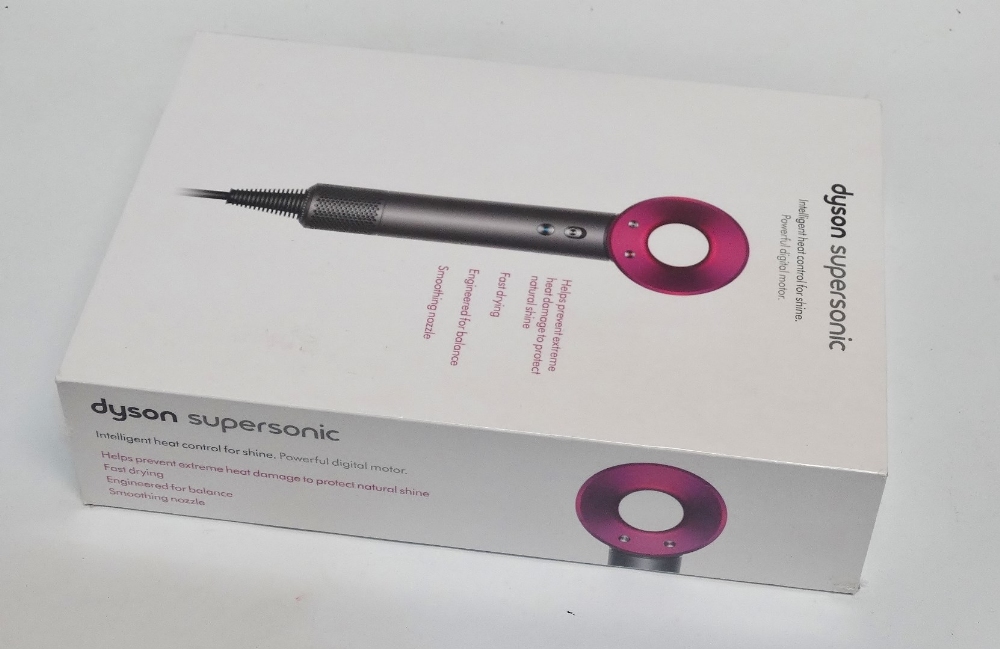 A Dyson supersonic hair dryer - iron and fuchsia, sealed within original box, apparently unused