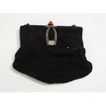 A ladies black silk evening bag - the diamante clasp incorporating a watch