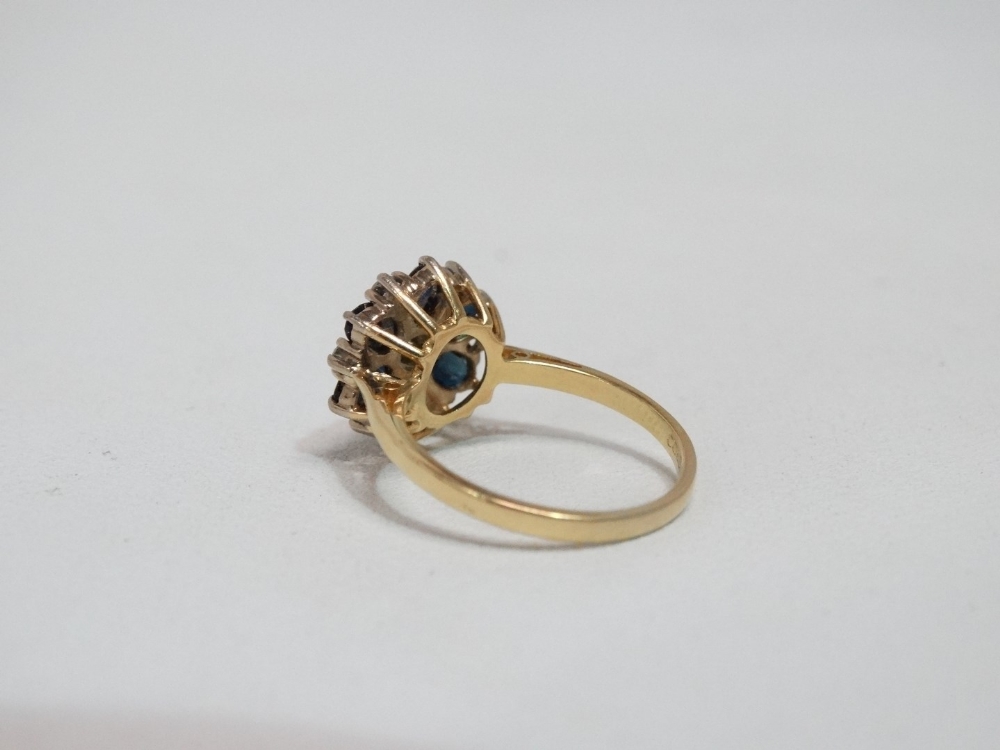 A sapphire and diamond floral shaped cluster ring - set in 18ct yellow gold, size M, weight 4.1g. - Image 2 of 4