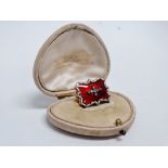 A late 19th century red enamel brooch - set with old mine cut diamonds, the brooch of rectangular
