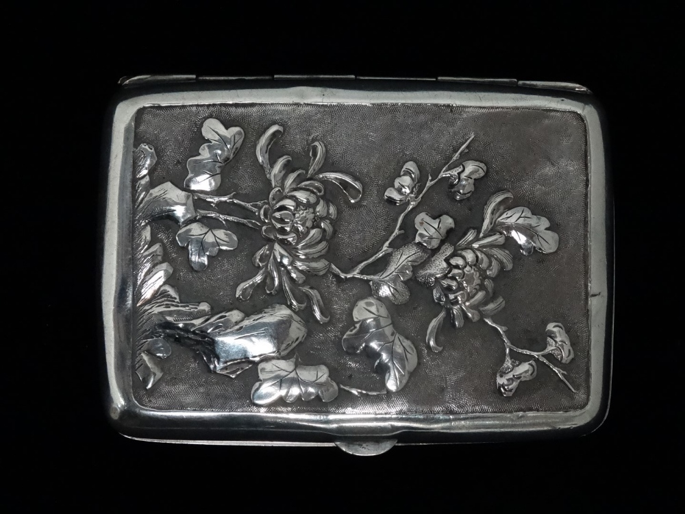 An early 20th century Chinese white metal cigarette case - decorated with a dragon amongst clouds, - Image 4 of 5