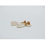 A pair of pearl drop earrings - On 9ct gold screw fittings, weight 3g.