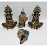 A pair of 20th century plaster table lamps modelled in the form of Thai drummers, polychrome