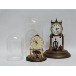 An early 20th century 'Anniversary' timepiece - the brass skeleton movement raised on columns, under