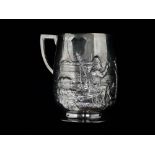 A silver christening mug - London 1907, of barrel form on a foot, repousse decorated with hunter and