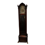 A 20th century oak longcase clock - the silvered chapter ring set out with Roman numerals, flanked