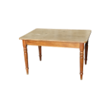 A 19th century mahogany table - the rectangular top raised on turned tapering legs, height 71cm,