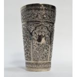 An early 20th century Indian silver beaker - Extensively decorated with foliage within shaped panels