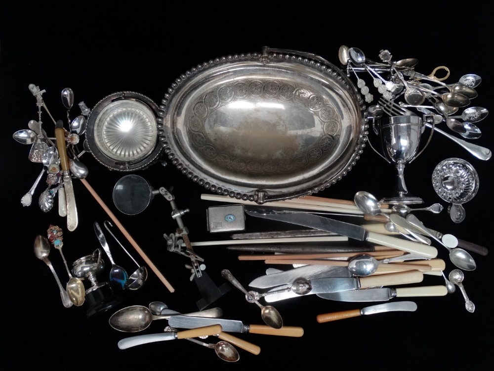 A quantity of plated wares - including an oval bread basket, novelty spoons and a butter dish.