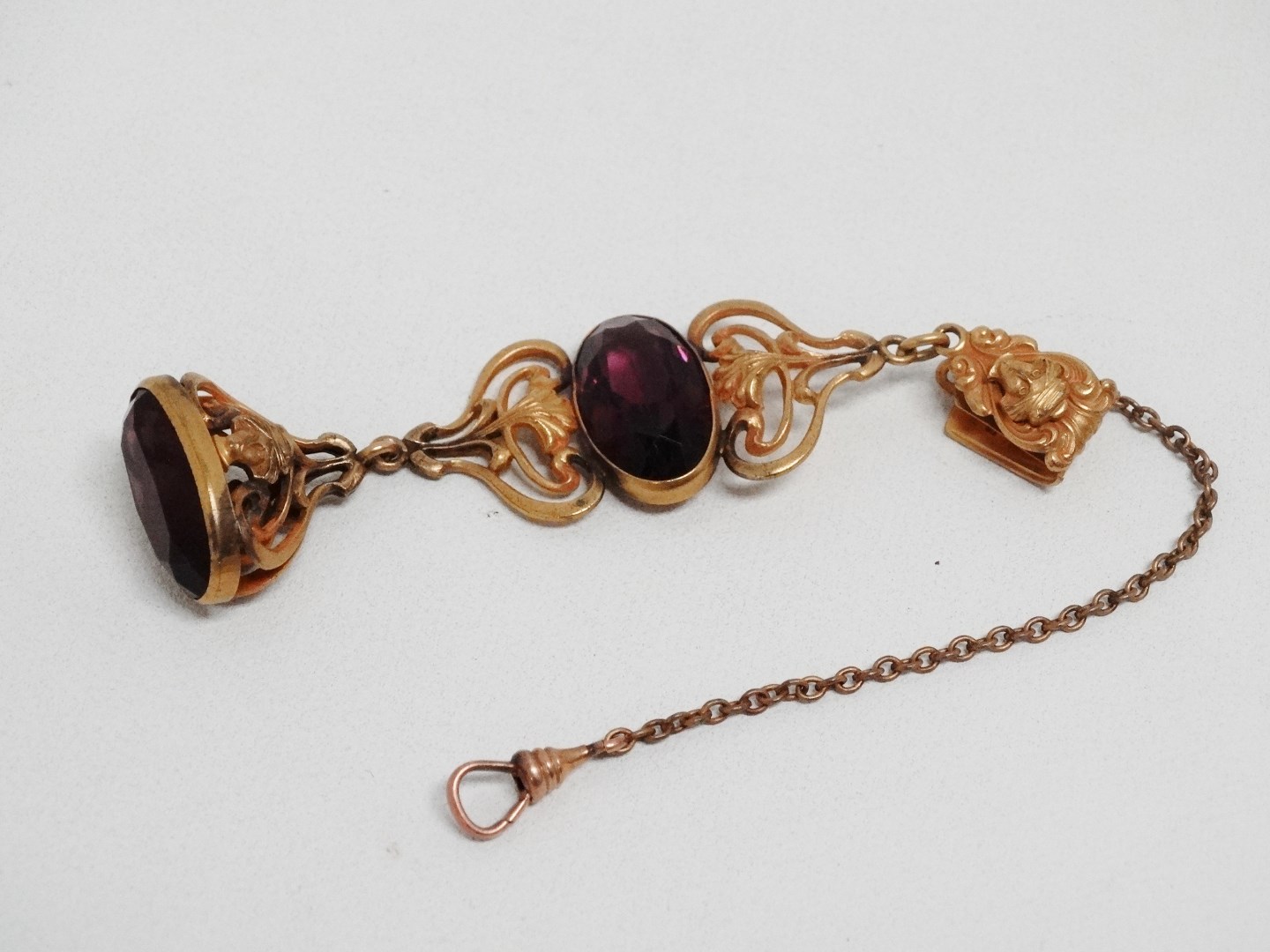 A late 19th century amethyst chatelaine type seal - set in gilt metal, length 10cm.