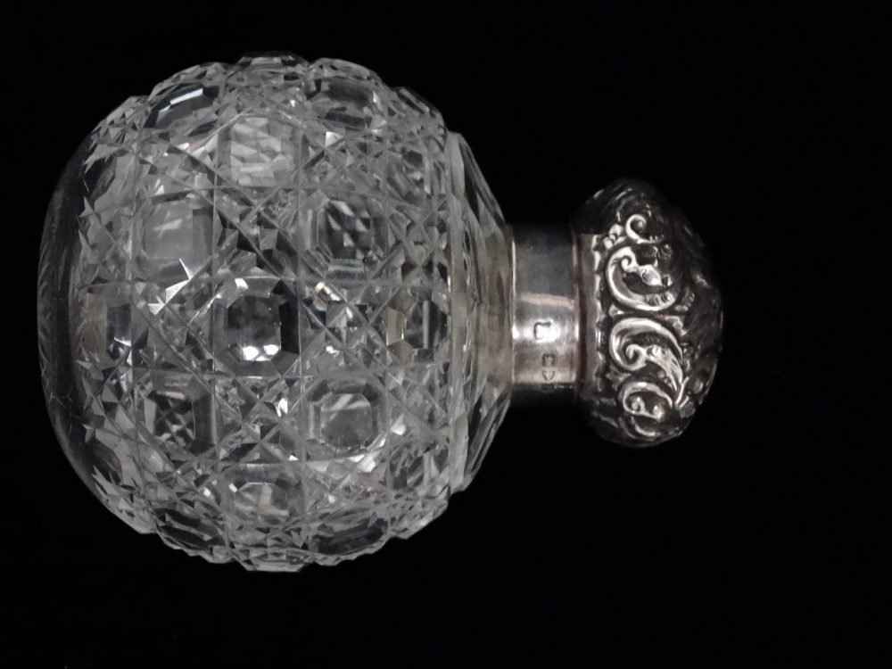 A silver topped scent bottle - Chester 1898, the screw top fitted to a cut glass lobed body, - Image 2 of 4