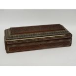 A late 19th Anglo Indian sandalwood glove box - caved with a fort on a foliate ground including