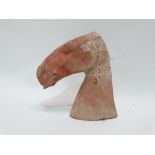 A Chinese terracotta horse head - possibly Tang period, height 22cm.
