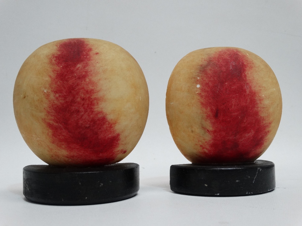 A pair of composite bookends - modelled as a sliced peach, height 10cm. - Image 2 of 3