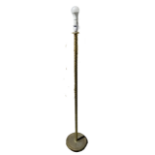 A brass standard lamp - with spiral column support on a circular base, height 143cm.