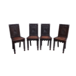 A set of four 17th century style oak hall chairs - The carved panel back above a solid seat with