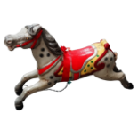 A 20th century child's carousel horse - dapple grey with a red saddle, height 66cm.