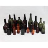 Eighteen various coloured glass bottles - including W. Hicks & Co. St Austell, Whitbread & Co.