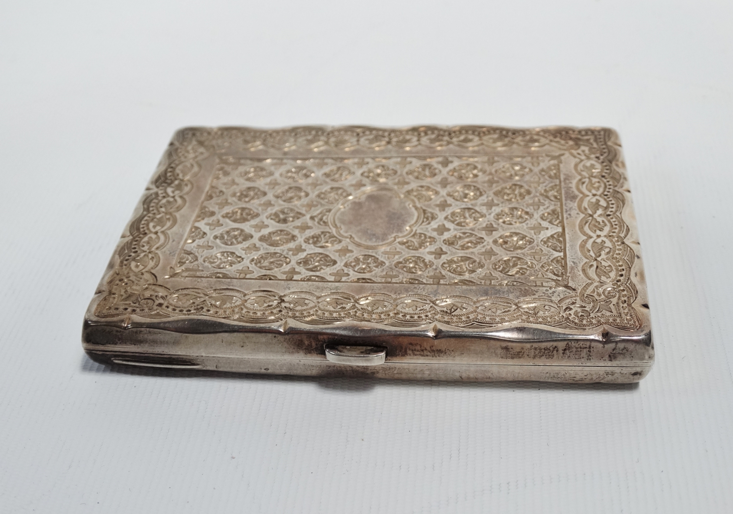 A silver note and card case - Birmingham 1880, rectangular engraved with foliage, 3oz (all in)